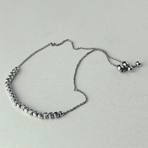 PULSERA DE PLATA AJUSTABLE CON BOLITAS